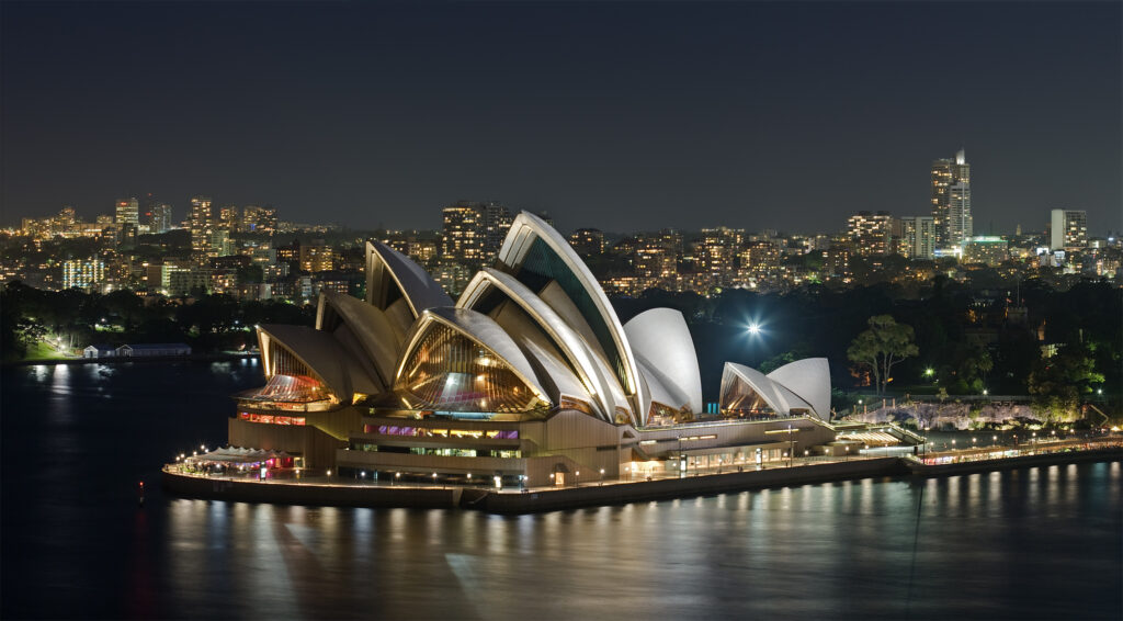 Sydney Opera House sails beside the harbour in Sydney