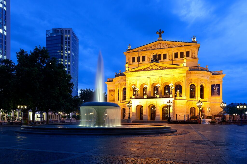 The Alte Oper opera house lit up in the evening in Frankfurt