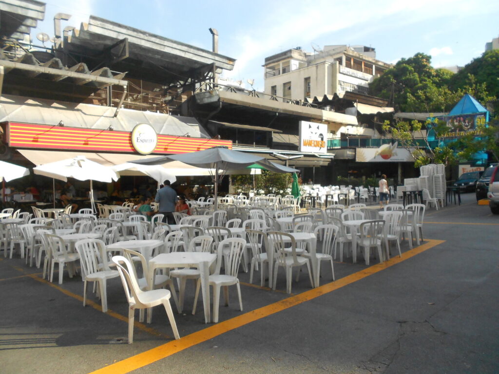 Open-air market stalls and dining tables at Cobal do Humaita in Rio de Janeiro