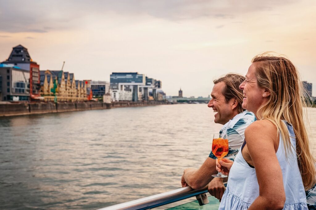 A sightseeing boat on the Rhine with Cologne Cathedral behind