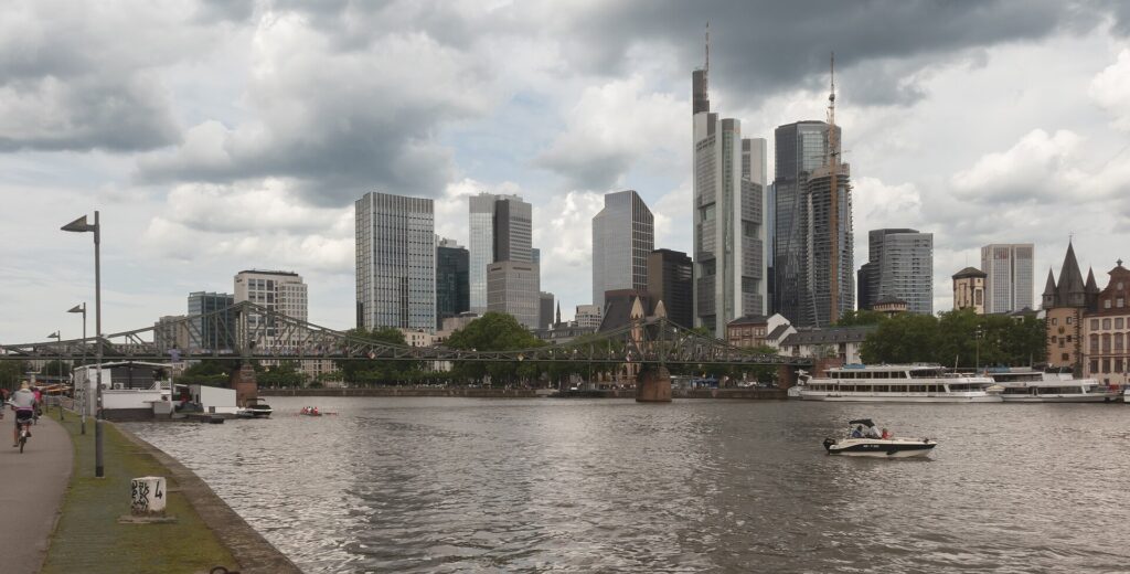 The Eiserner Steg footbridge and skyline over the river Main in Frankfurt