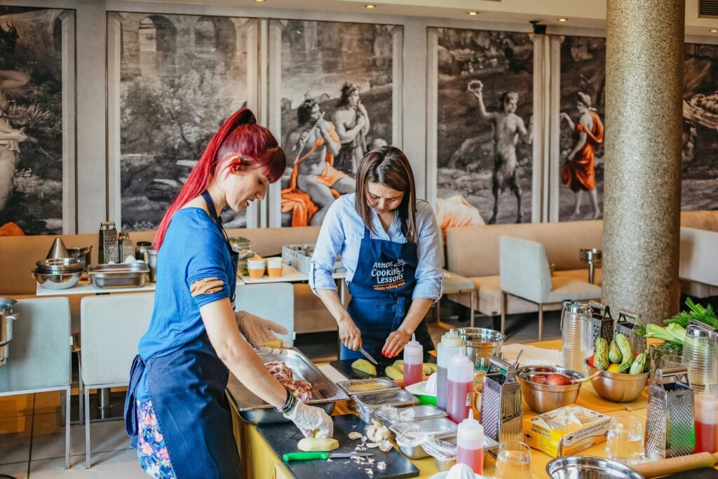 Guests preparing food at a Greek cooking class in Athens