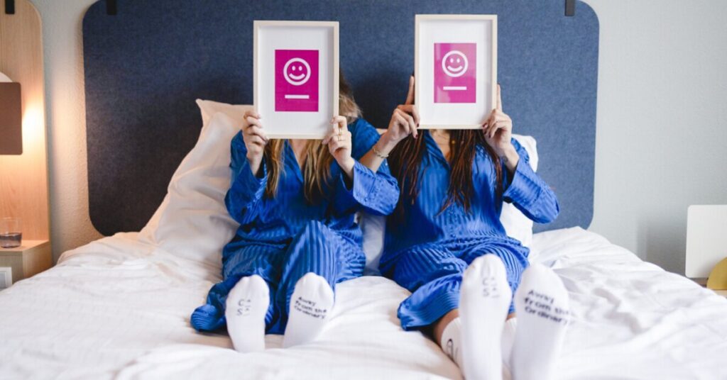 Guests relaxing in blue robes in a Hotel Casa room in Amsterdam
