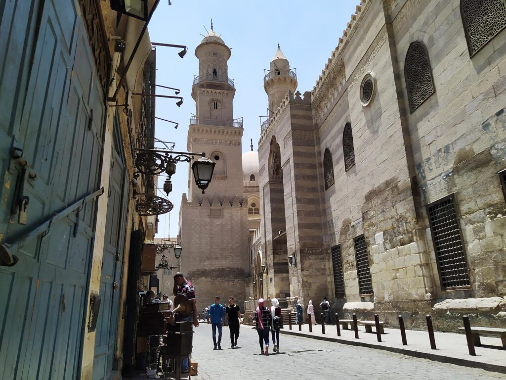 A historic street with a minaret in Islamic Cairo