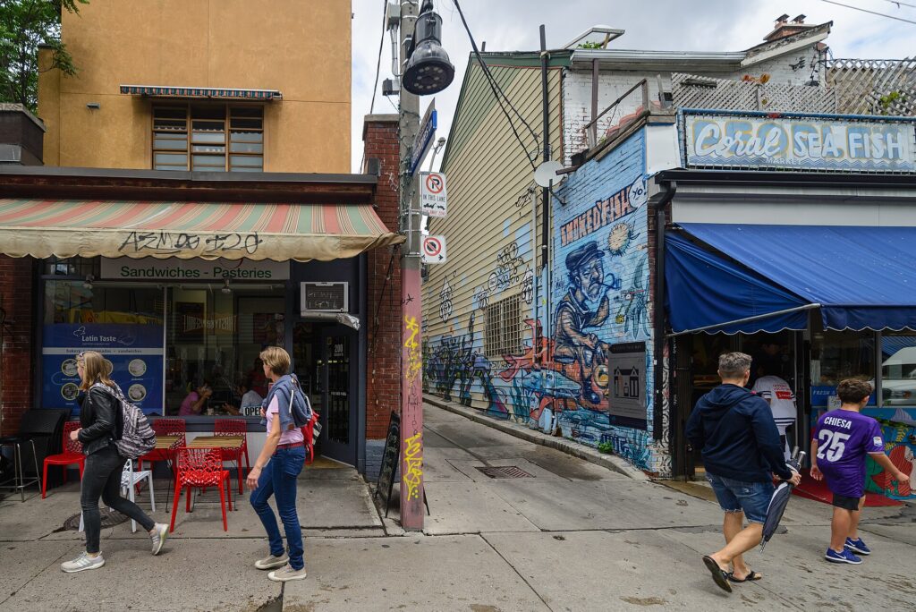 A graffiti-lined street in Kensington Market Toronto