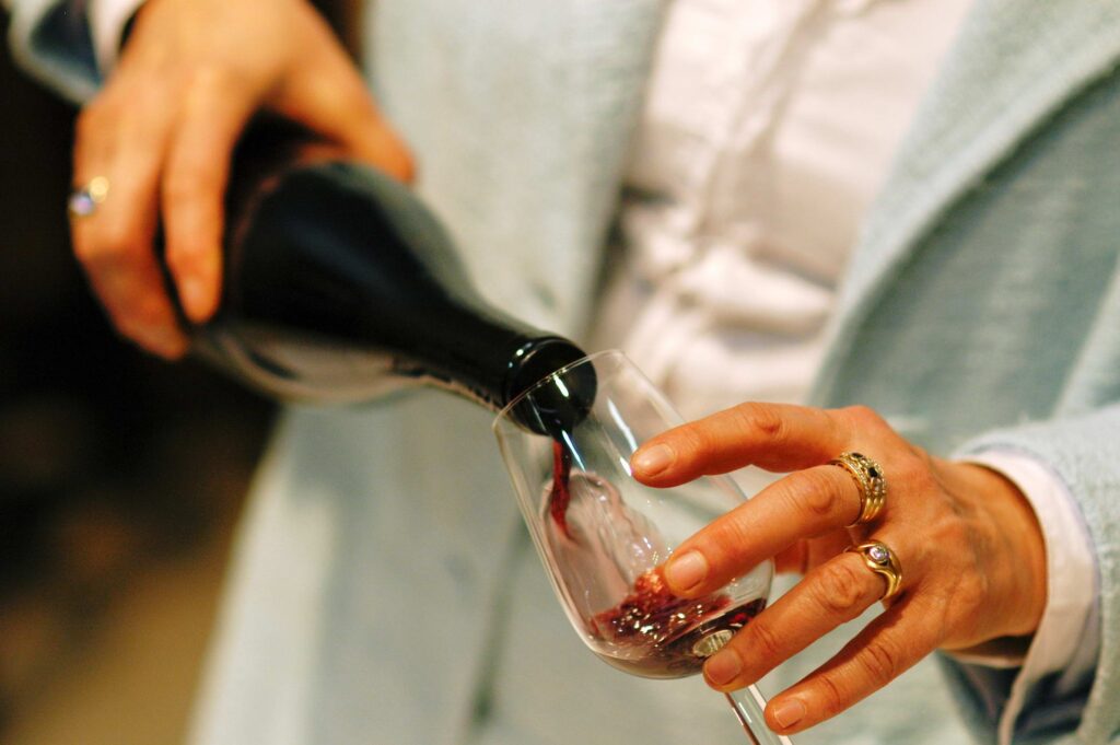 Red wine being poured into a glass