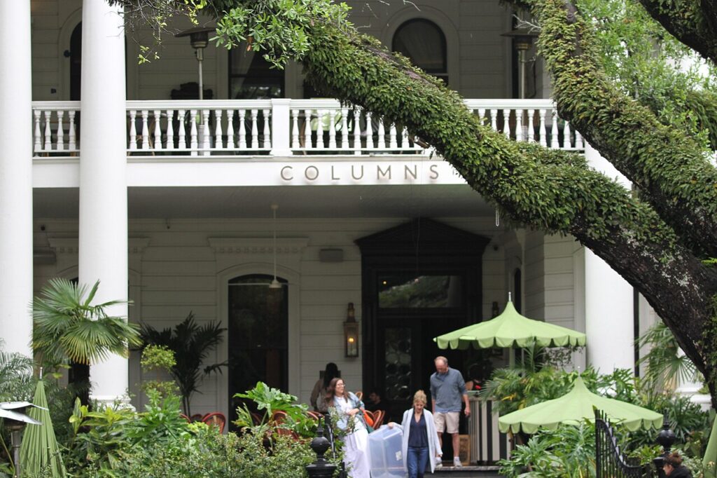 The columned front porch of The Columns hotel on St. Charles Avenue