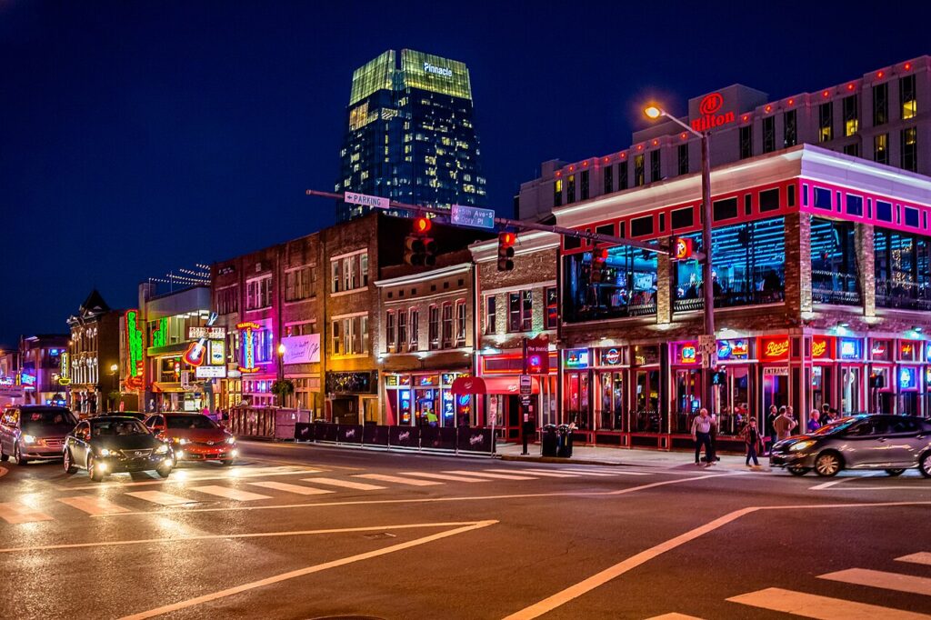 Neon honky-tonk signs on Lower Broadway in downtown Nashville at night