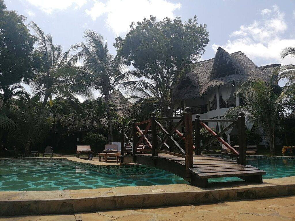 A tropical resort pool, evoking The Standard Spa on Belle Isle
