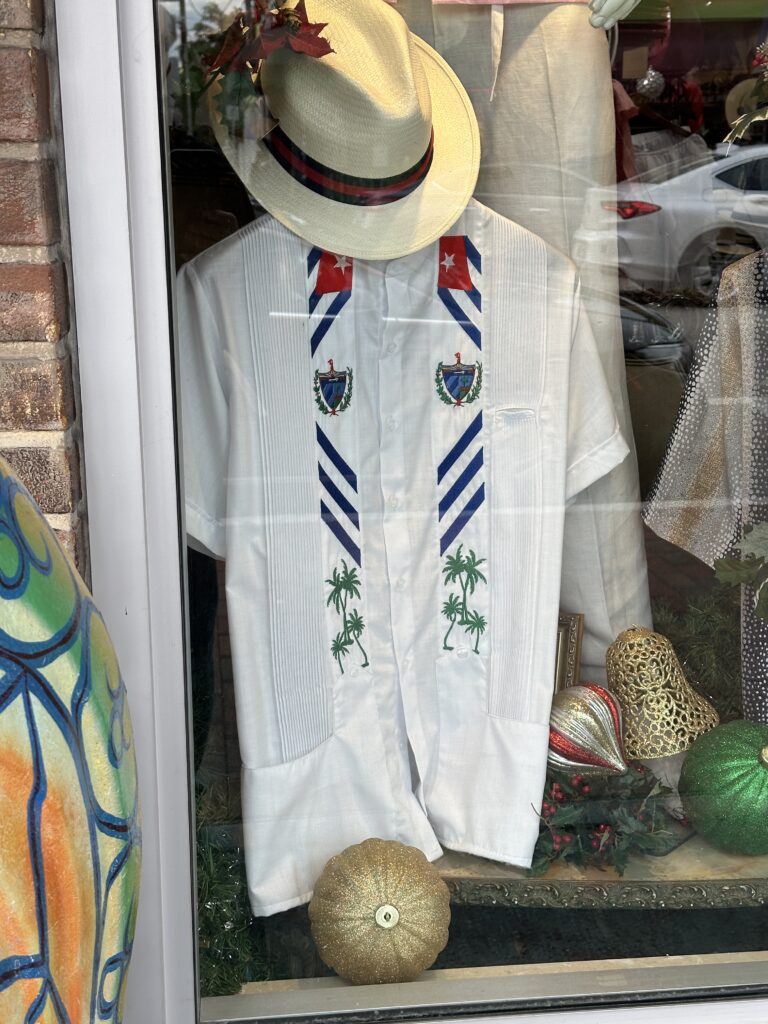 A Cuban guayabera shirt and hat in a Little Havana shop window, Miami