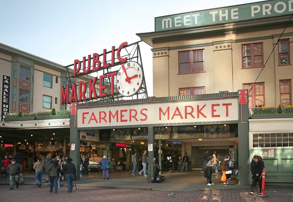 Pike Place Market with its neon sign and clock in downtown Seattle