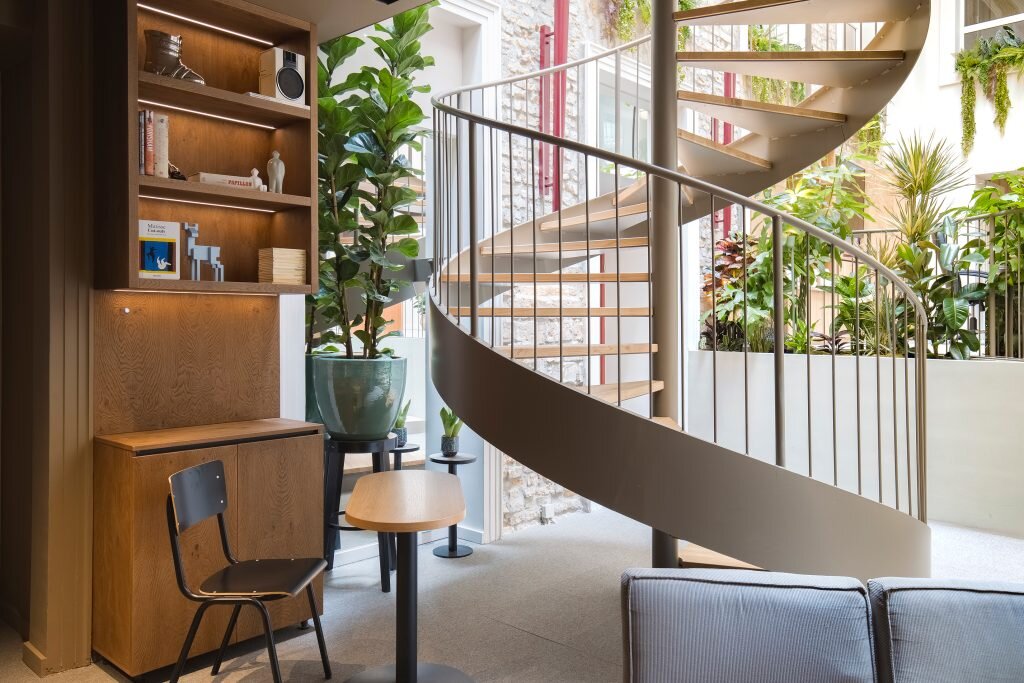 Maverick City Lodge hostel lounge with spiral staircase in Budapest