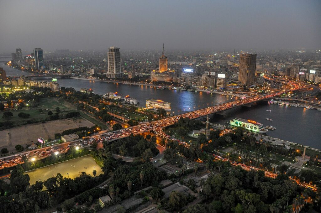 The Nile and city bridges lit up at night in Cairo