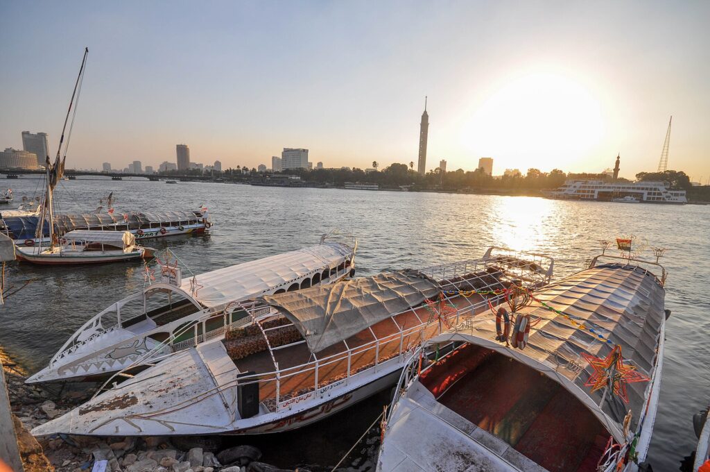 The Nile with boats and the Cairo Tower in Cairo