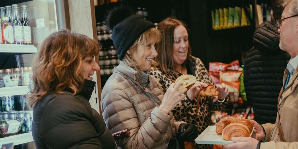 Guests sampling Quebecois food on an Old Quebec food tour