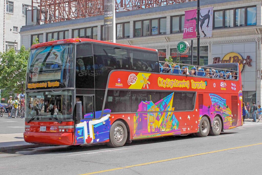 A double-decker sightseeing bus in downtown Toronto